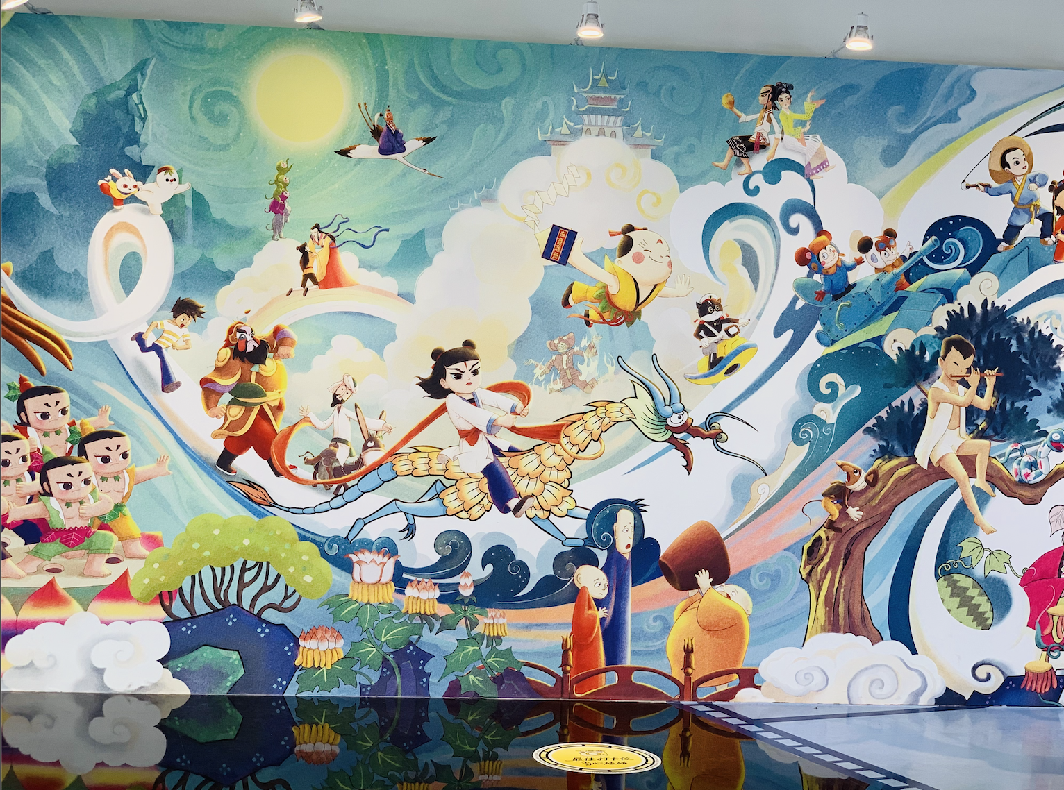 Colorful mural featuring classic Chinese animated characters, including Sun Wukong and the Calabash Brothers, at a Chinese animation exhibition.
